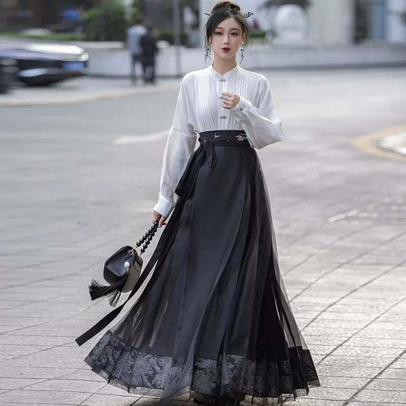 black dress eastern HANIYA This elegant black embroidered outfit reflects a perfect blend of sophistication and modern eastern fashion. The dress features a rich black base fabric beautifully decorated with delicate floral embroidery in soft